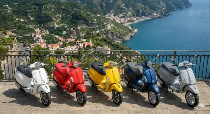 CDA Rent showroom exterior featuring an outdoor display of new scooters and Piaggio Vespas